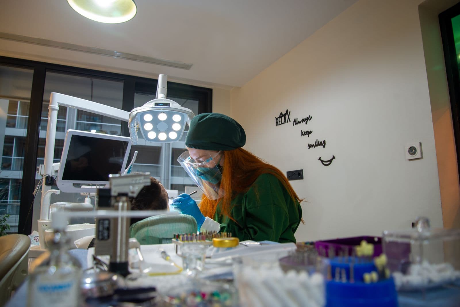 Dermatologist treating a patient in a modern GlowDerm treatment room
